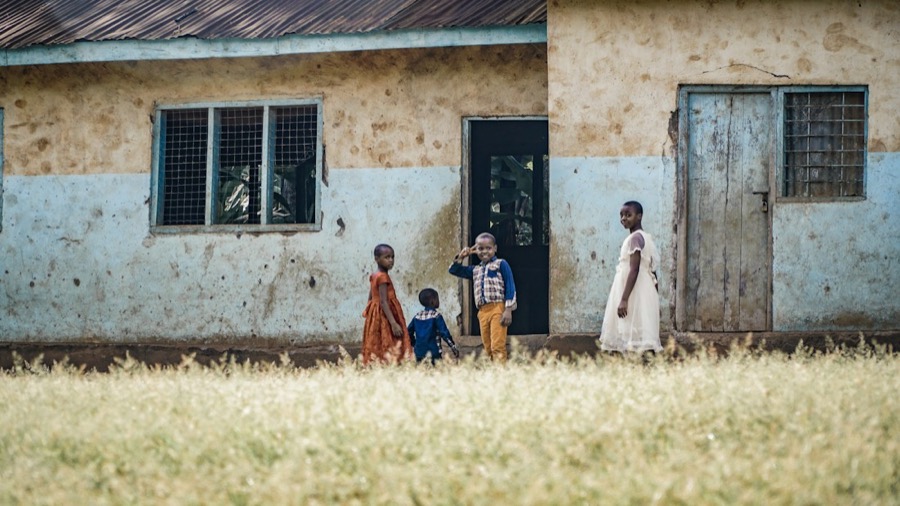 School classroom block with pupils outside